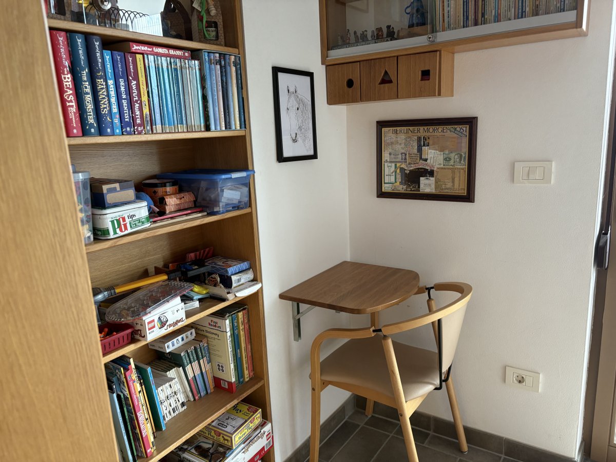 Handy table for reading books and studying treasure maps.. Also used for building lego..