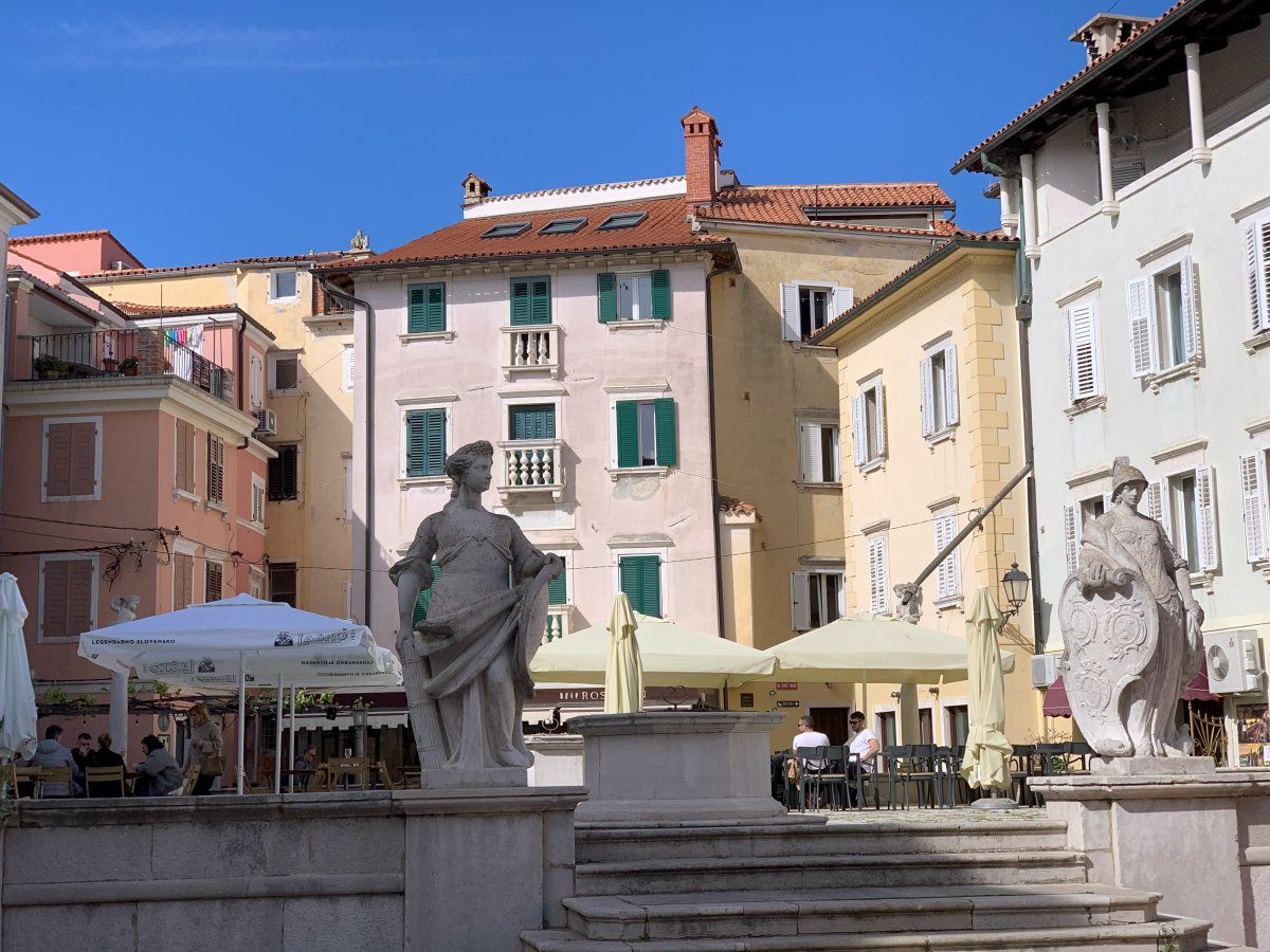 Suddenly you pop out into a square like this serving the best calamari in town..