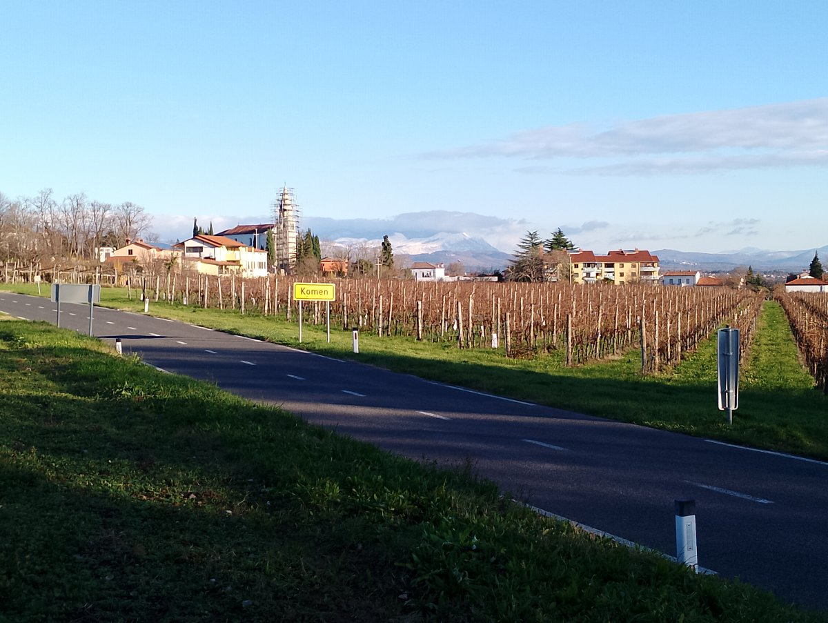 pretty Komen is the main village at the top of the Red Karst, typically surrounded by vineyards..