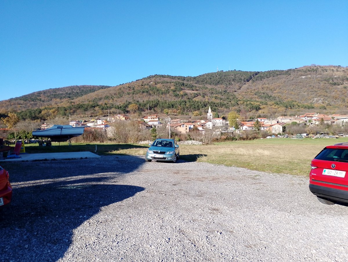 another typical Red Karst village with white church near the farmhouse..