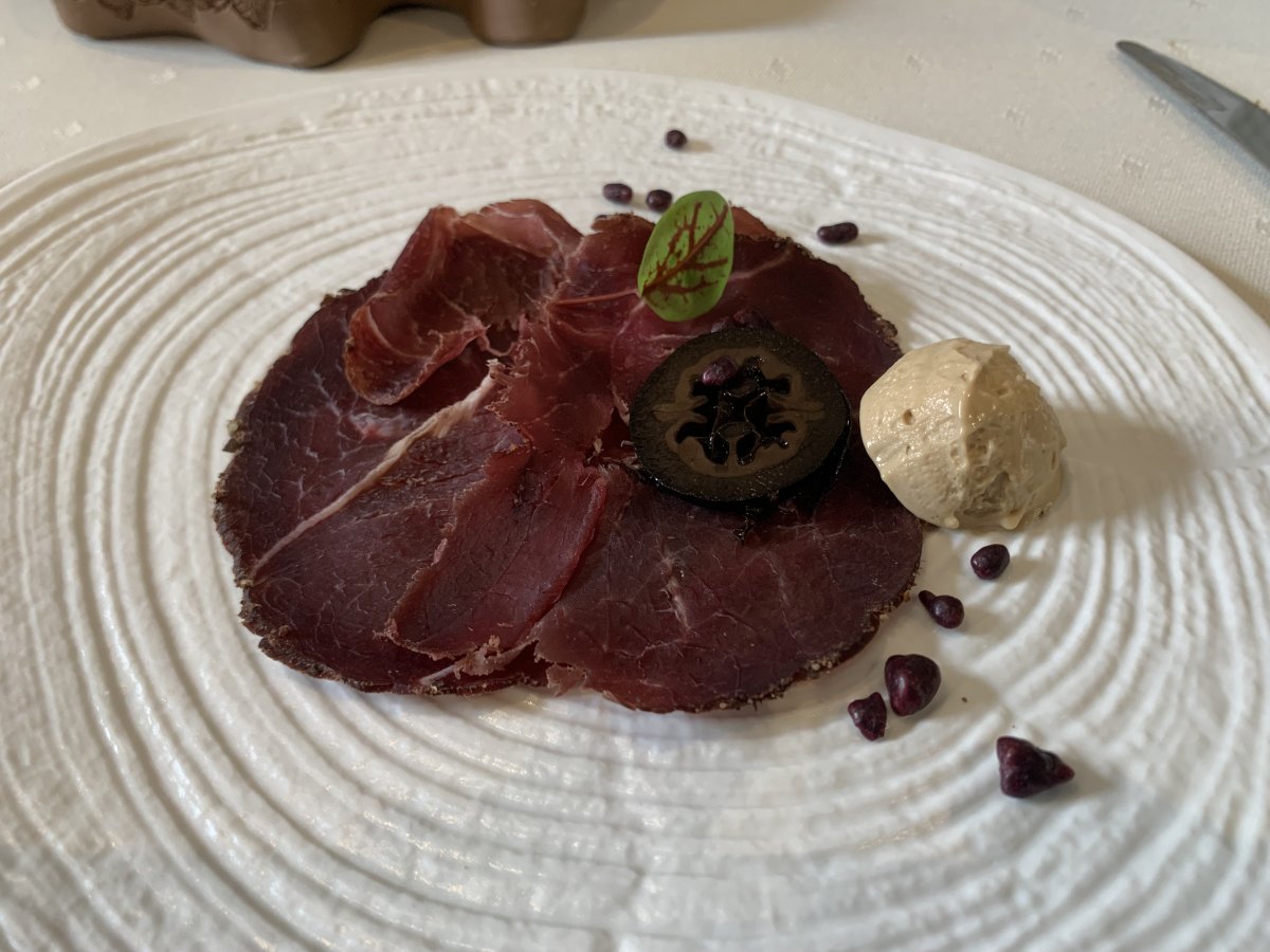 Bear prosciutto, porcini mushroom ice cream, black walnut and blackcurrant starter at Mahorcic.. Bear prosciutto, porcini mushroom ice cream, black walnut and blackcurrant starter at Mahorcic..