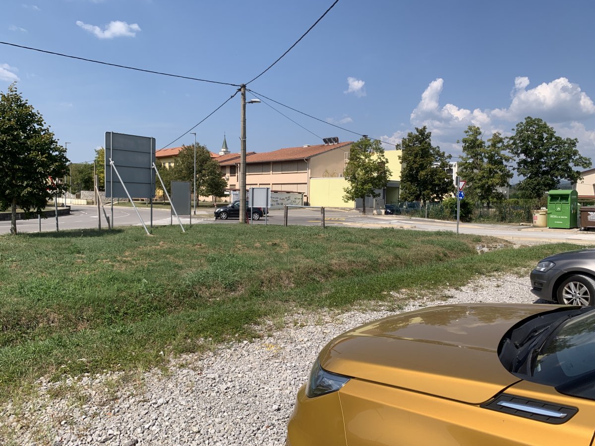 another car park next to the recyling bins at the edge of Rence..