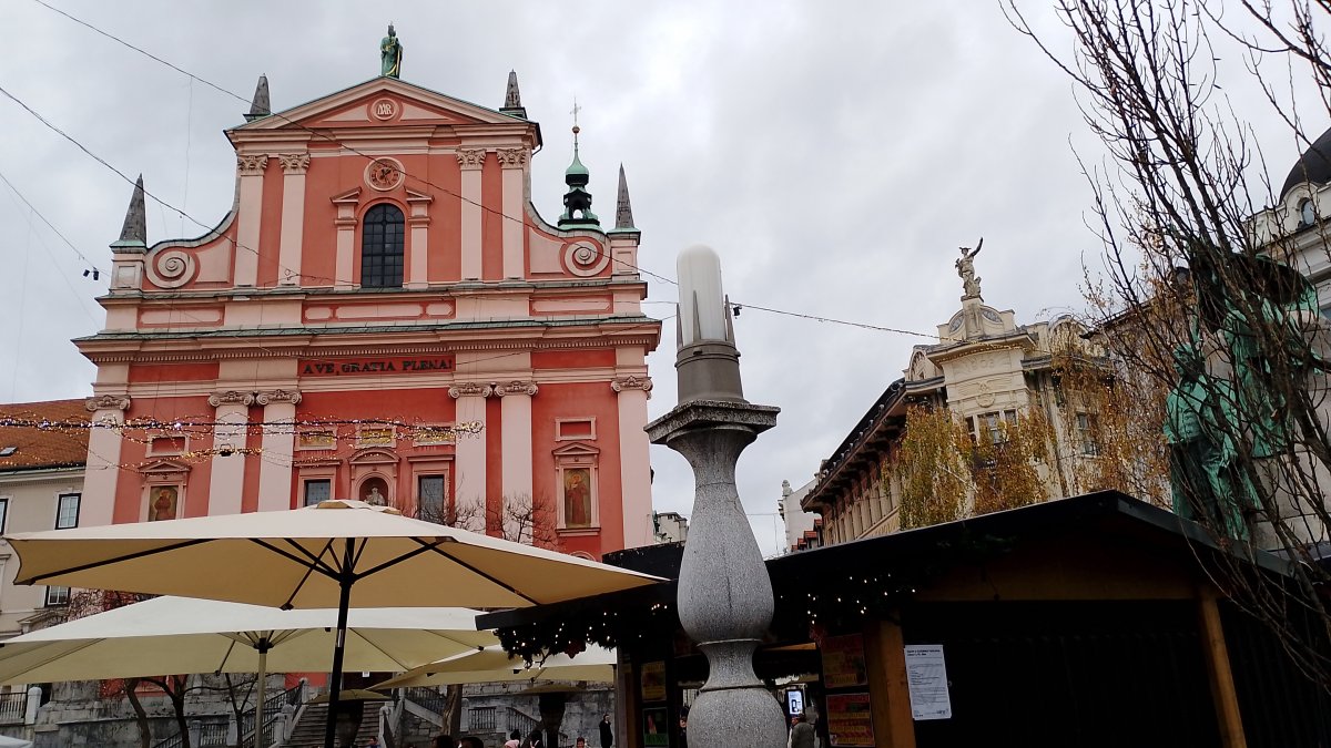 Ljubljana.. Big pink church in the central square, which is a circle..