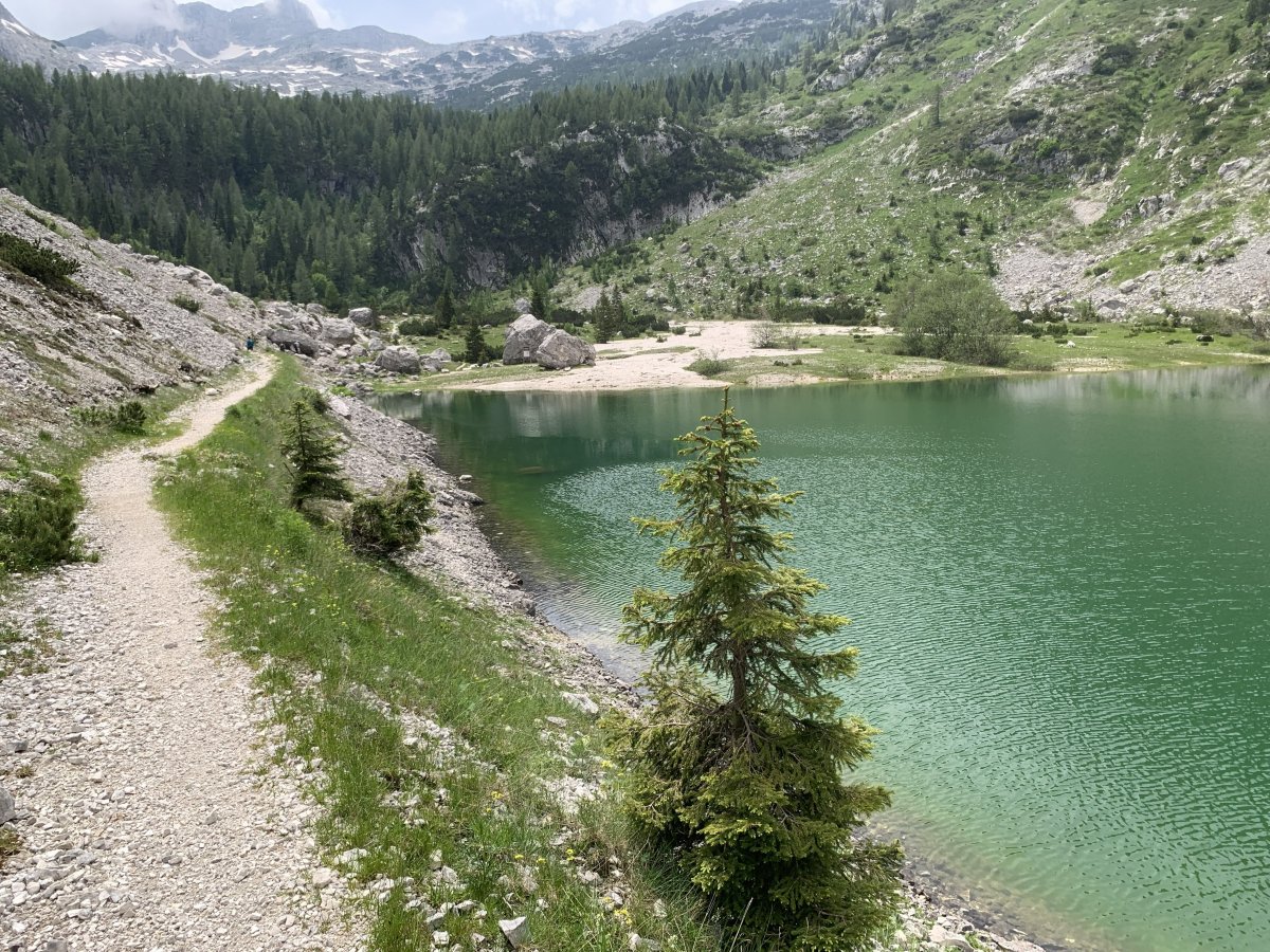 Just imagine hiking to the highest lake in Slovenia and finding a white beach at the far end..